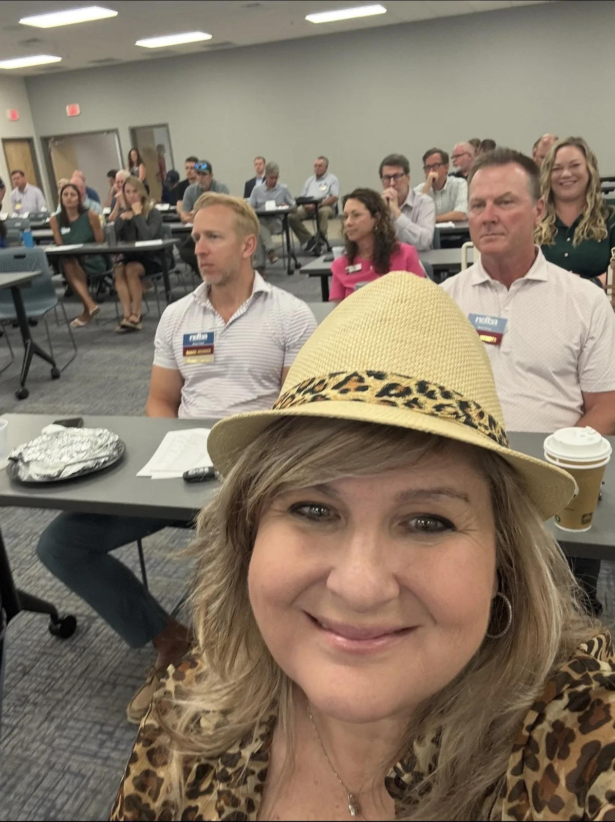 Stevi at a local business networking event with a room full of owners